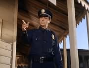 Cop #1 (Hollis Morrison)